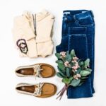 Outfit - brown leather boots beside blue denim jeans