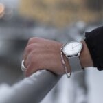 Outfit Jewelry - person wearing silver round analog watch with black leather strap
