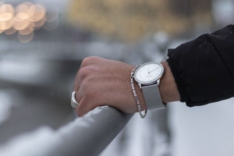 Outfit Jewelry - person wearing silver round analog watch with black leather strap