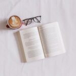 Book - book near eyeglasses and cappuccino