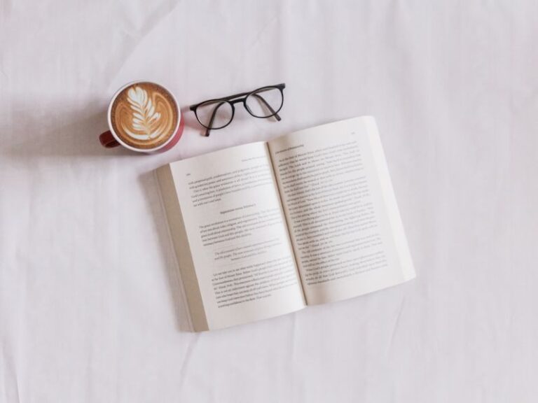 Book - book near eyeglasses and cappuccino