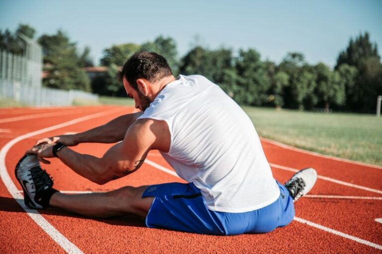 Stretching - man in white sleeveless top