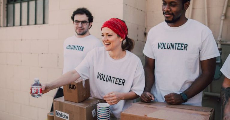Volunteering Rewards - Three People Donating Goods