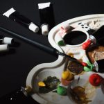 Affordable Materials - A palette with paint brushes and paint tubes