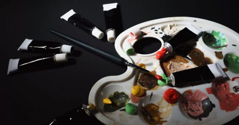 Affordable Materials - A palette with paint brushes and paint tubes