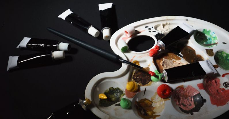 Affordable Materials - A palette with paint brushes and paint tubes