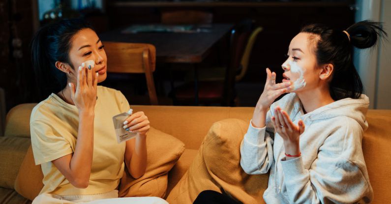 Home Spa DIY - Woman in White Sweater and Black Pants Sitting on Brown Couch