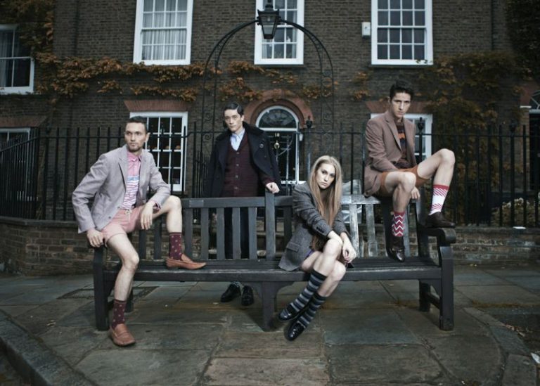 Unique Fashion - photography of group of people sitting on bench