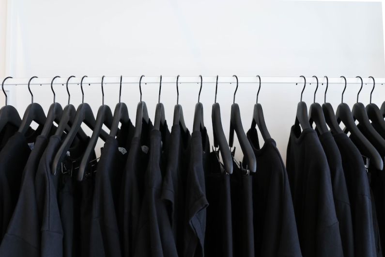 Oversized Trend - black clothes hanged in rack