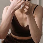 Anti-aging Tips - A Red-Haired Woman Putting a Facial Mask