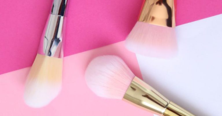 Minimalist Makeup - Makeup Brush Set over a Pink Surface