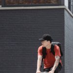 Healthy Cities - Man in Orange T-shirt Riding on Bicycle